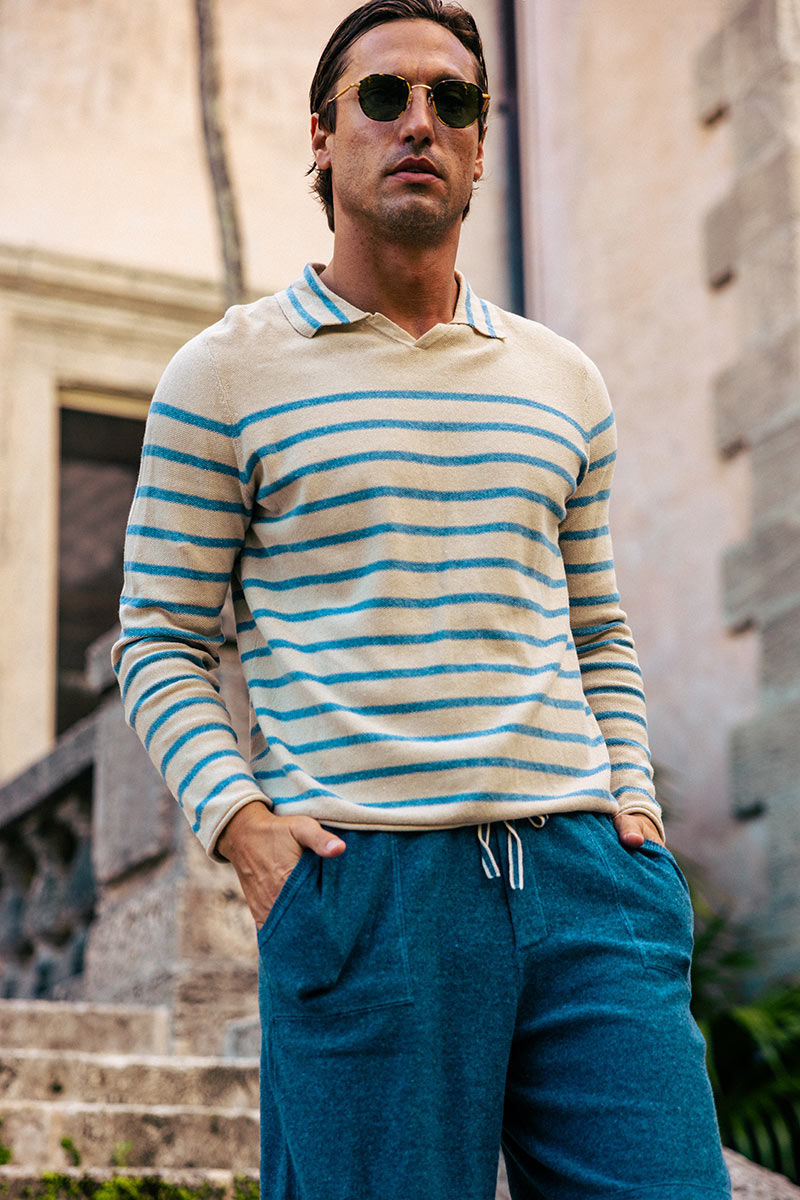 Male model wearing Linen-Blend Striped Long-Sleeve V-Neck Polo Sweater